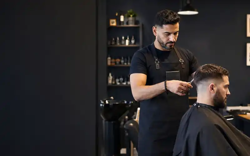 Professional barber cutting a client's hair